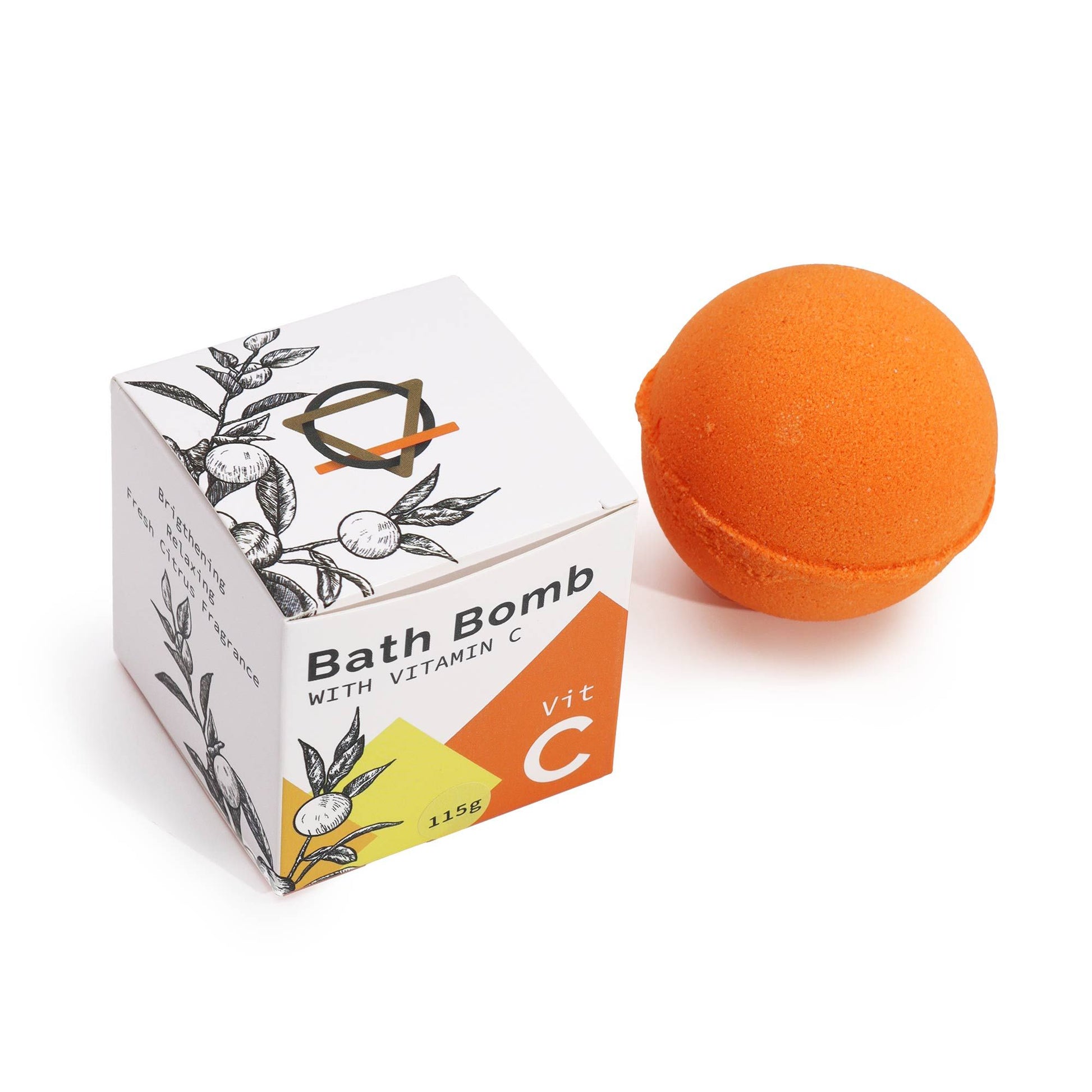 Bomba de baño naranja junto a caja blanca con diseño vegetal y Vitamina C.