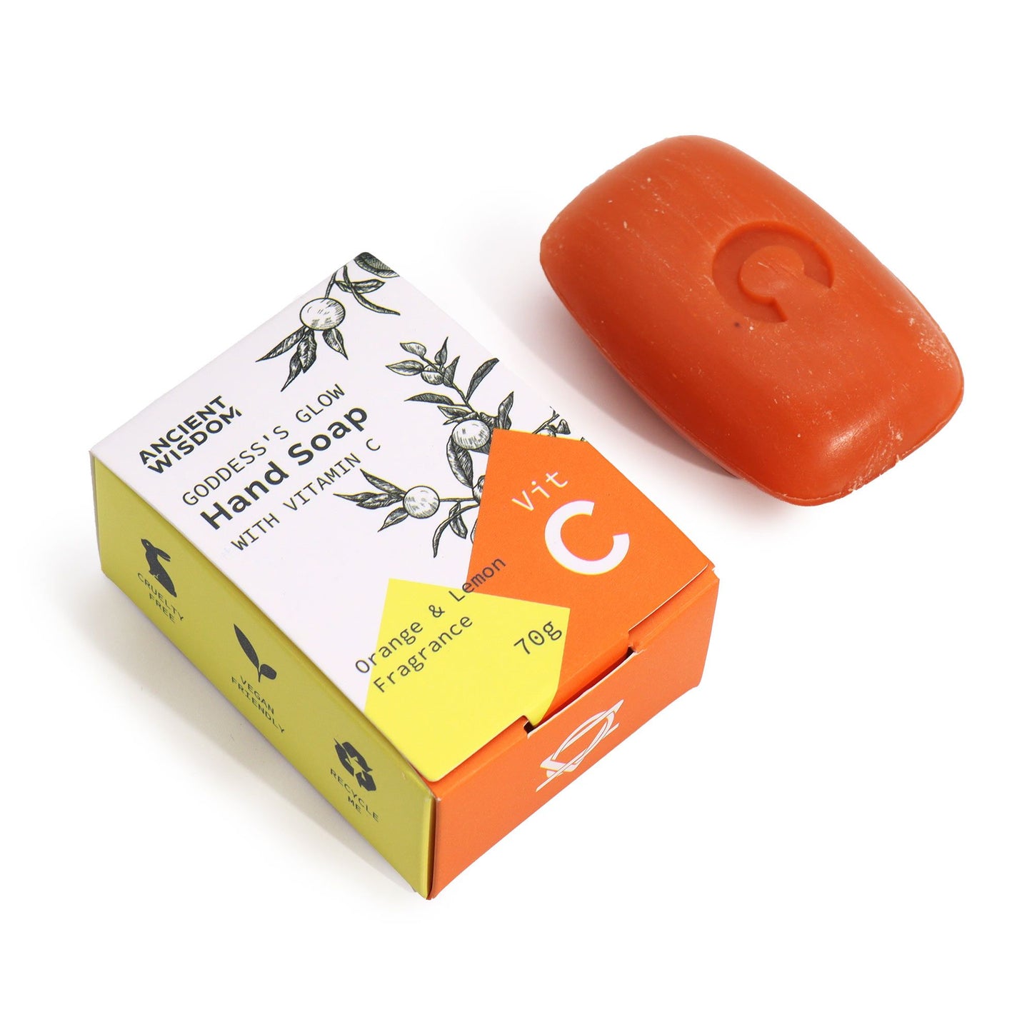 Jabón de manos con vitamina C y aceites esenciales en tono naranja junto a su caja decorativa.